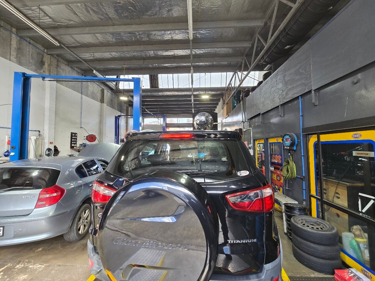 Vehicles being serviced inside the Tyre Storee workshop